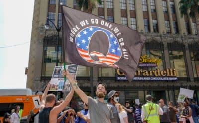 Conspiracy theorist QAnon demonstrators protest child trafficking on Hollywood Boulevard in Los Angeles, California, Aug. 22, 2020. (Kyle Grillot/AFP via Getty Images)