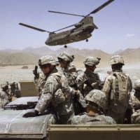 American soldiers from the 10th Mountain Division deploy to fight Taliban fighters as part of Operation Mountain Thrust to a U.S. base near the village of Deh Afghan on June 22, 2006 in the Zabul province of Afghanistan.  (Photo by John Moore/Getty Images)