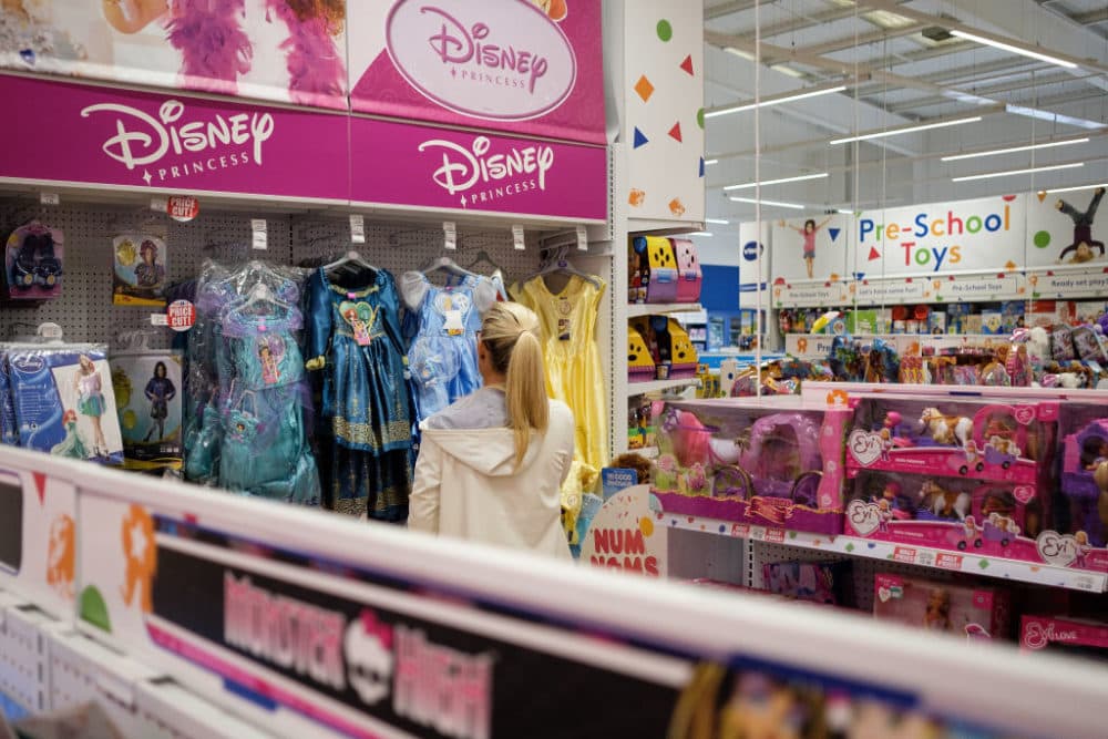 A woman browses the costume selection in Toys "R" Us in 2017. (Leon Neal/Getty Images)