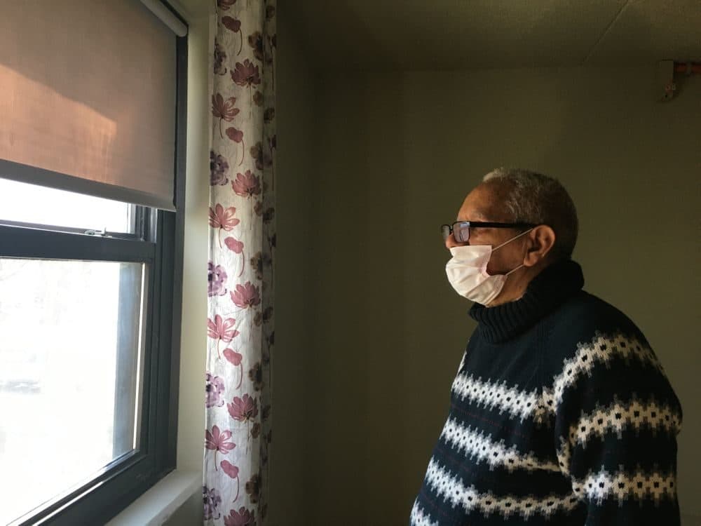 Filiberto Paredes in his home in Providence. (Sofia Rudin/RIPR)