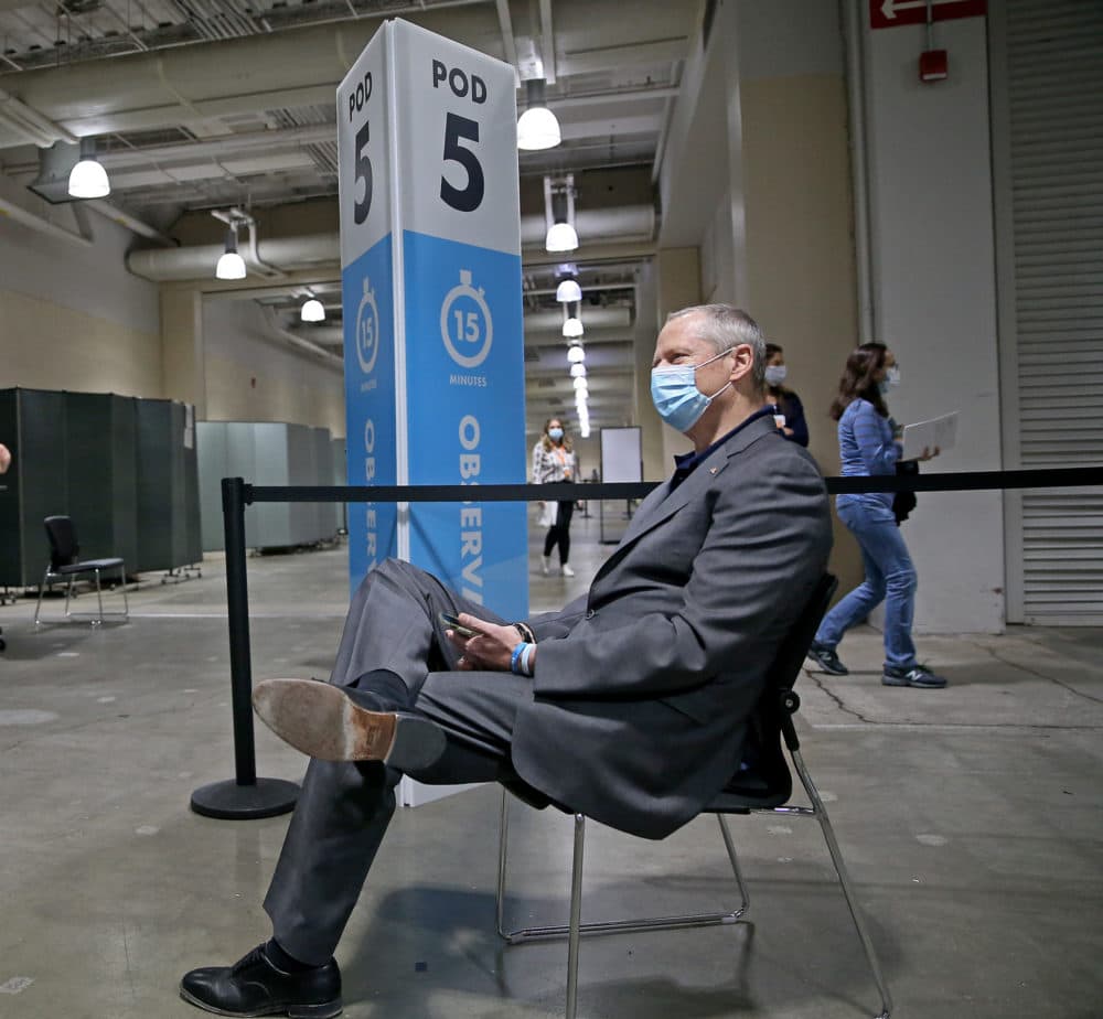 Baker waits in the observation area after receiving his vaccine. (Matt Stone/MediaNews Group/Boston Herald)