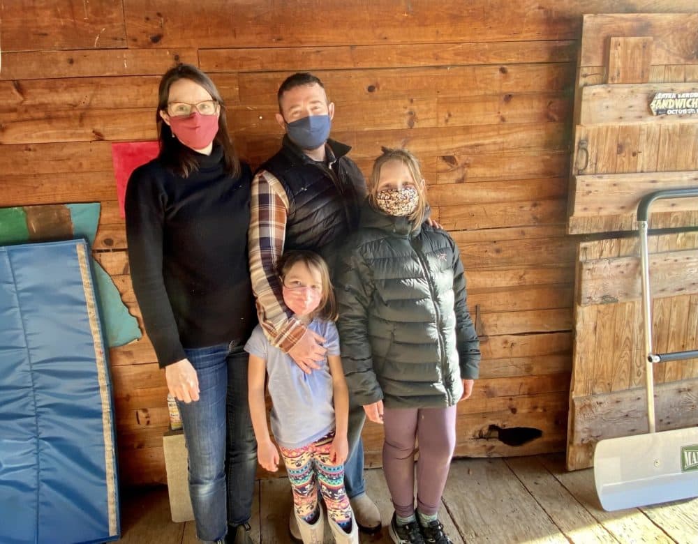 Emily Hyde and Eric Shelov, with their daughters Joanna and Lydia. (Sarah Gibson/NHPR)