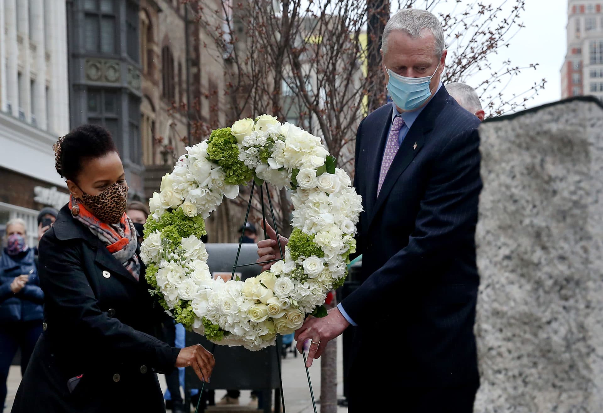 Gov. Charlie Baker and acting Mayor Kim Janey place a wreath at the site of the Boston Marathon Bombing Memorial. (Nancy Lane/MediaNews Group/Boston Herald)