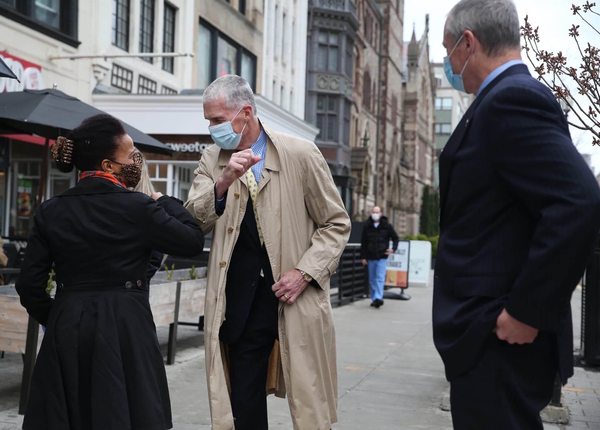 Baker watches as Janey exchanges elbow bumps with Thomas Grilk, president of the B.A.A. (Nancy Lane/MediaNews Group/Boston Herald)
