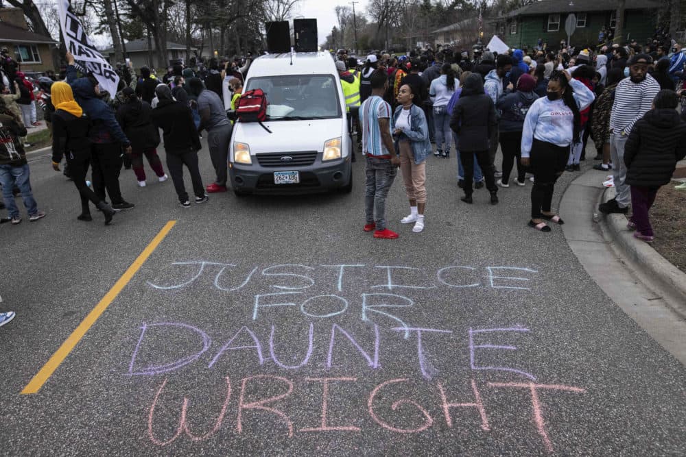 People gather in protest, Sunday, April 11, 2021, in Brooklyn Center, Minnesota. (Christian Monterrosa/AP)