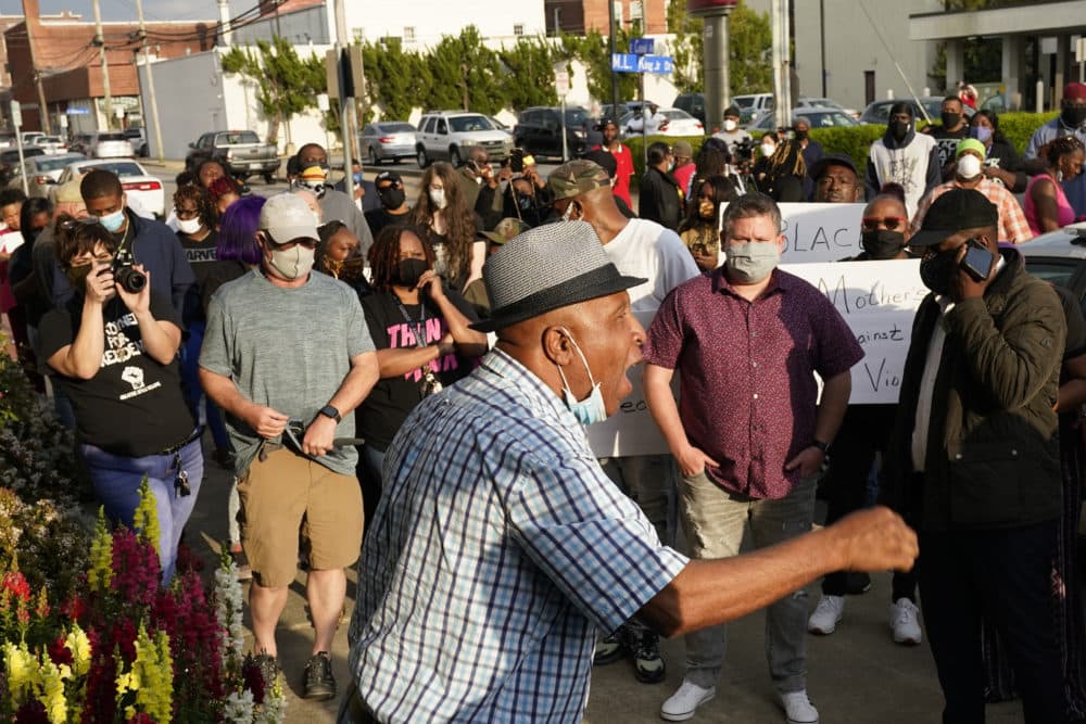 People gather outside the municipal building in Elizabeth City, N.C. (Gerry Broome/AP)