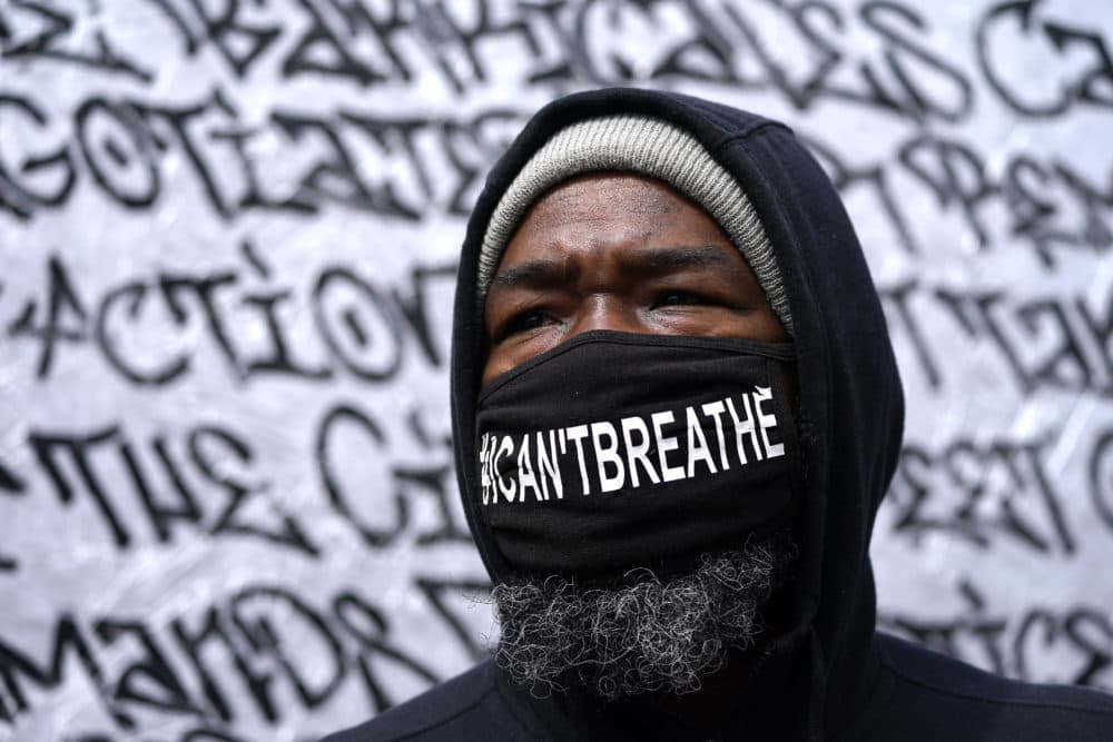 Kenneth Holt, 48, looks on as he visits George Floyd Square a day after former Minneapolis police Officer Derek Chauvin was convicted on all counts for the 2020 death of Floyd, Wed., April 21, 2021, in Minneapolis. (Julio Cortez/AP)