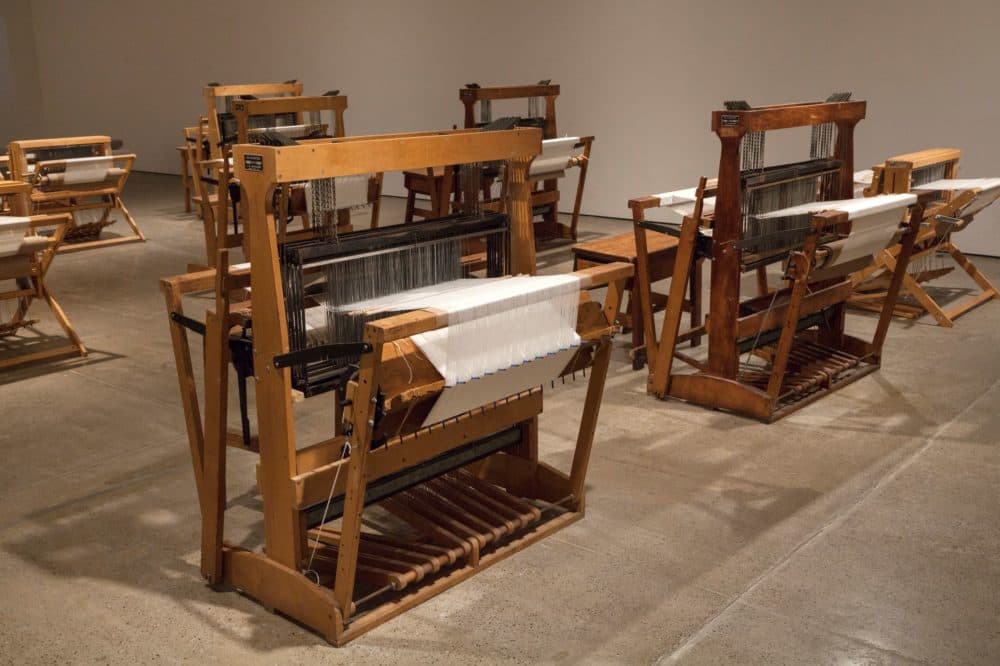 Wooden looms sit in the middle of Sonya Clark's exhibit "Monumental Cloth, The Flag We Should Know" at deCordova Sculpture Park and Museum. (Courtesy Carlos Avendaño)