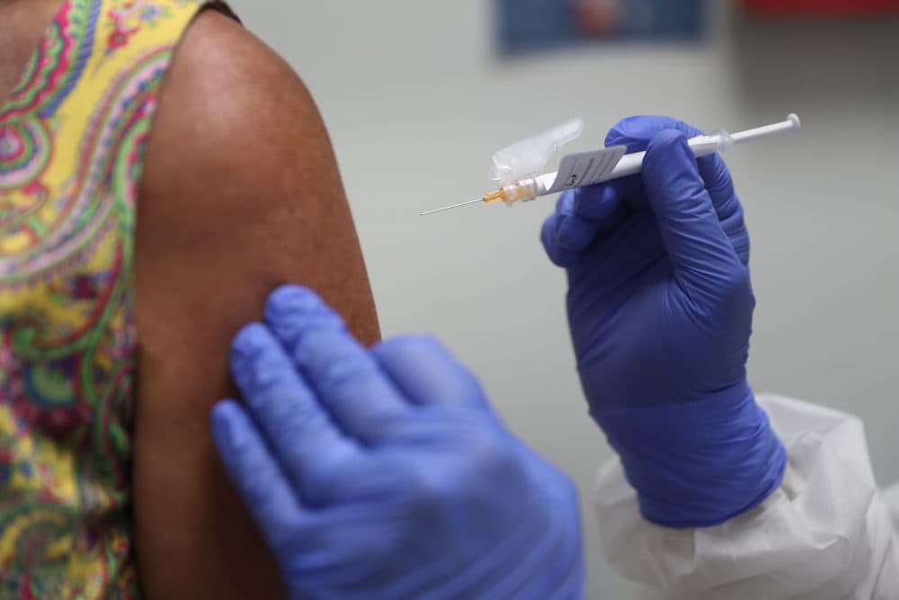 A woman received a COVID-19 vaccine. (Joe Raedle/Getty Images)