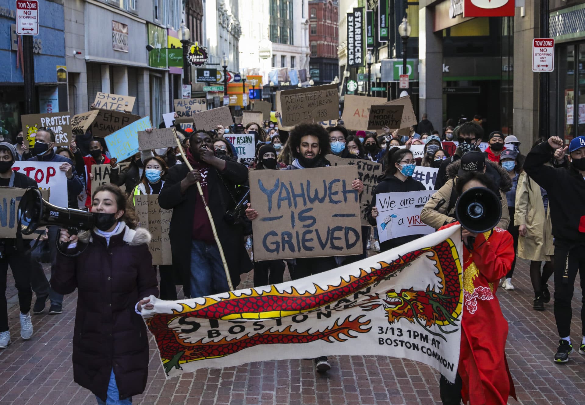 Hundreds marched through Chinatown en route to the State House during a "Stop Asian Hate" rally in Boston on March 13. (Erin Clark/The Boston Globe via Getty Images)