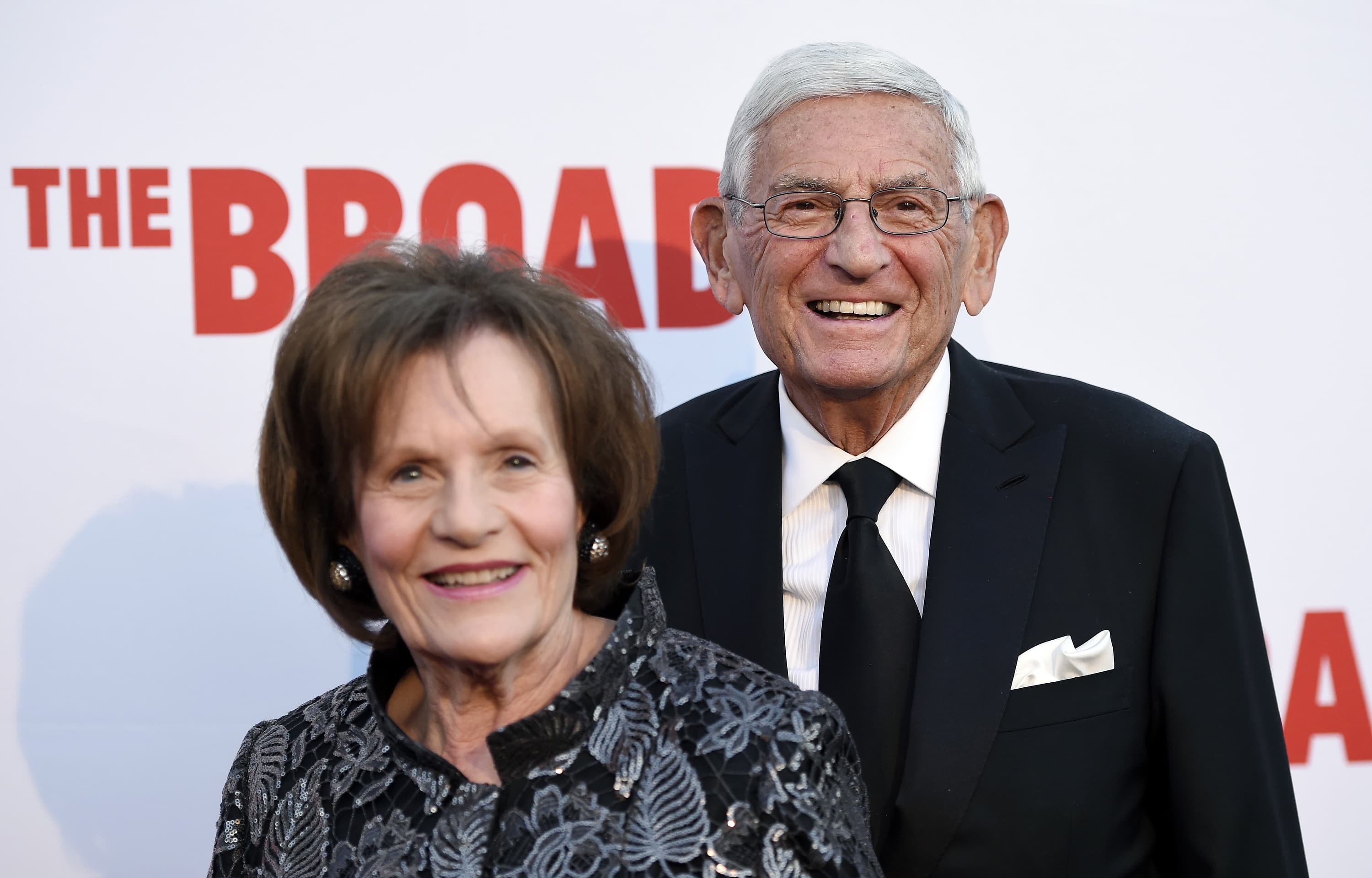 In this Sept. 17, 2015 photo, Eli Broad, right, founder of The Broad museum, arrives with his wife Edythe at the museum's opening in Los Angeles. (Chris Pizzello/ Invision/AP File)
