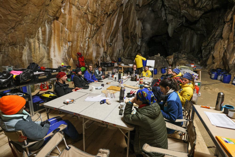 A group of people in a cave with no way to tell the time. (Deep Time © Human Adaptation Institute)