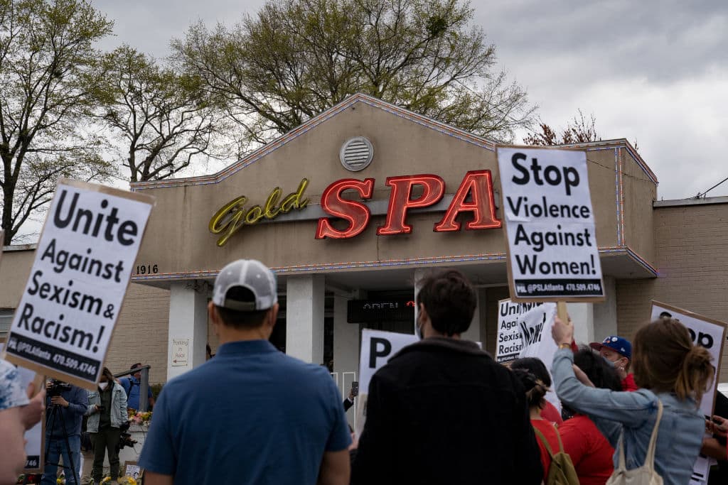 Activists demonstrate outside Gold Spa following a shooting where three women were gunned down on March 18, 2021 in Atlanta, Georgia. The suspect was arrested after a series of shootings at three Atlanta-area spas left eight people dead, including six Asian women. (Megan Varner/Getty Images)