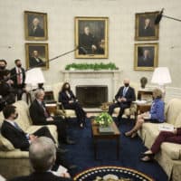 President Joe Biden speaks to the press during a meeting with (L-R) Transportation Secretary Pete Buttigieg, Sen. Mike Crapo (R-ID), Vice President Kamala Harris, Sen. Shelley Capito (R-WV), and Commerce Secretary Gina Raimondo, to discuss the administration’s infrastructure plan at the White House on May 13, 2021 in Washington, D.C. (T.J. Kirkpatrick-Pool/Getty Images)