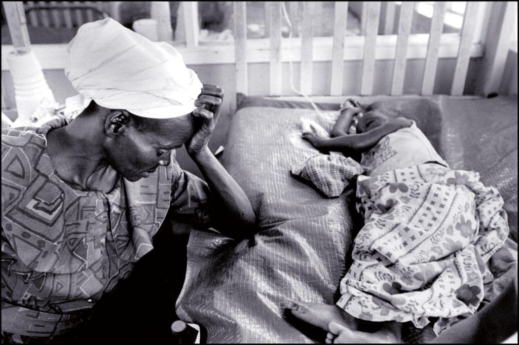 A mother and her child suffering from AIDS taken in January 1998. (Anne Nosten/Gamma-Rapho via Getty Images)