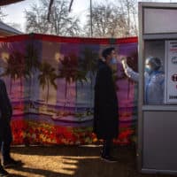 A Kashmiri health worker takes a nasal swab sample to test for COVID-19 in Srinagar, Indian-controlled Kashmir, Saturday, Dec. 19, 2020. (Dar Yasin/AP)