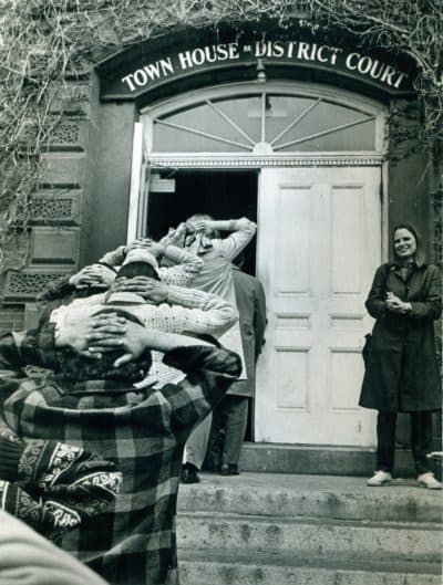 Vietnam veterans make a POW pose as they enter Middlesex County Court after their arrest in Lexington. (Courtesy Boston Herald Traveler photo archives at the Boston Public Library)