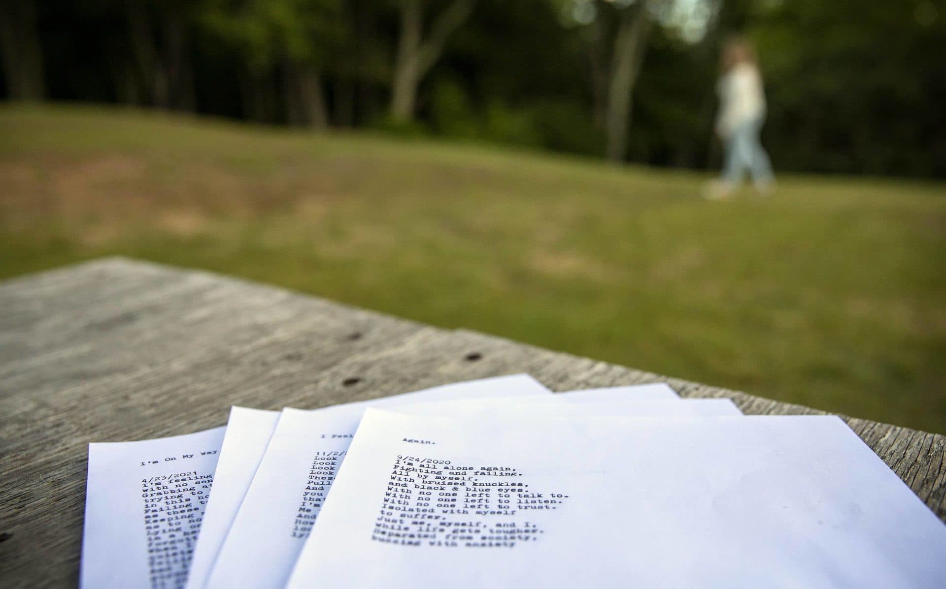Marie writes poetry to help process her emotions. The first line of one poem reads, "I'm all alone again." (Robin Lubbock/WBUR)