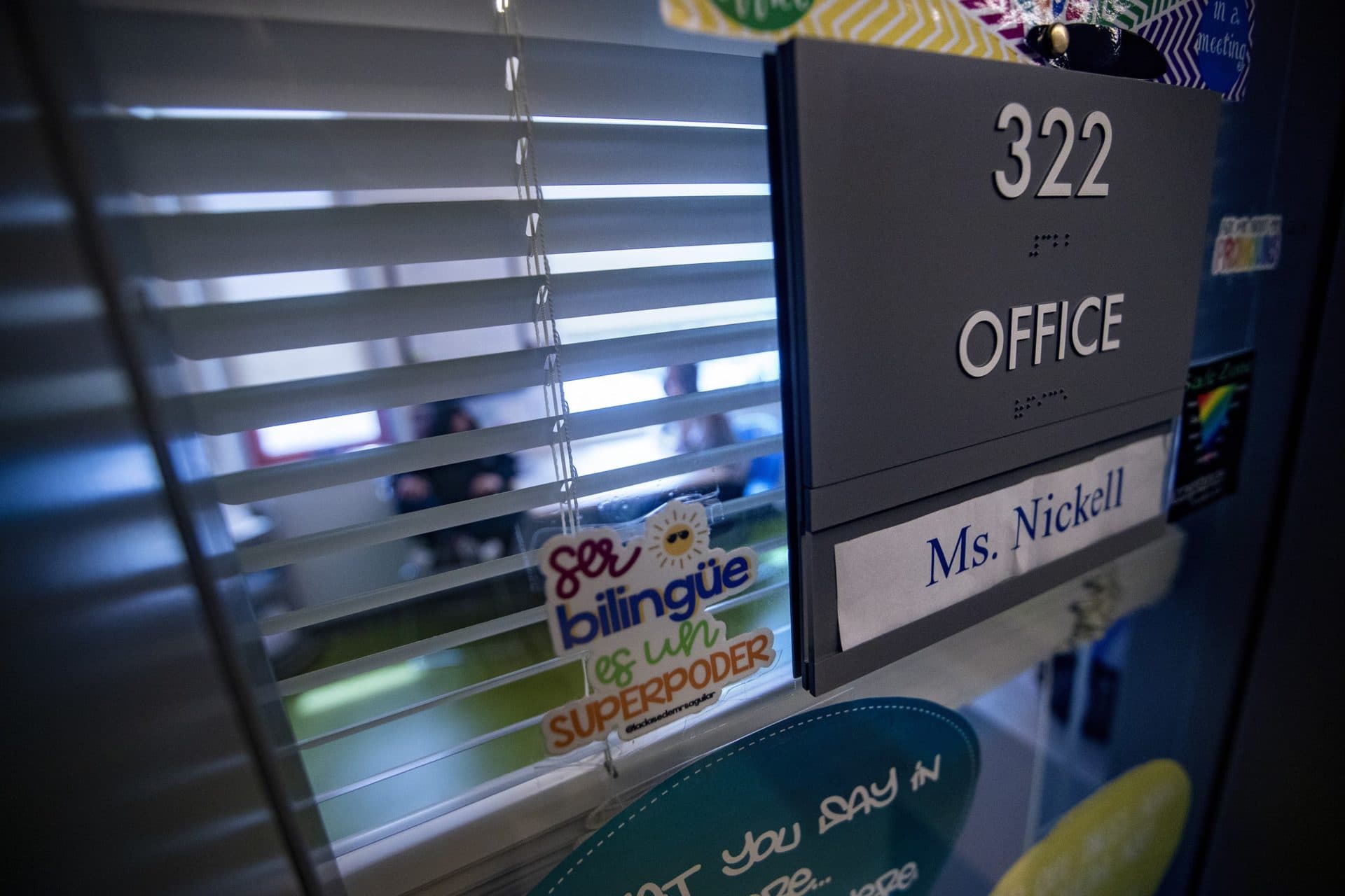 School social worker Caitlin Nickell meets with a student in her office at the Clark Avenue Middle School in Chelsea. (Jesse Costa/WBUR)