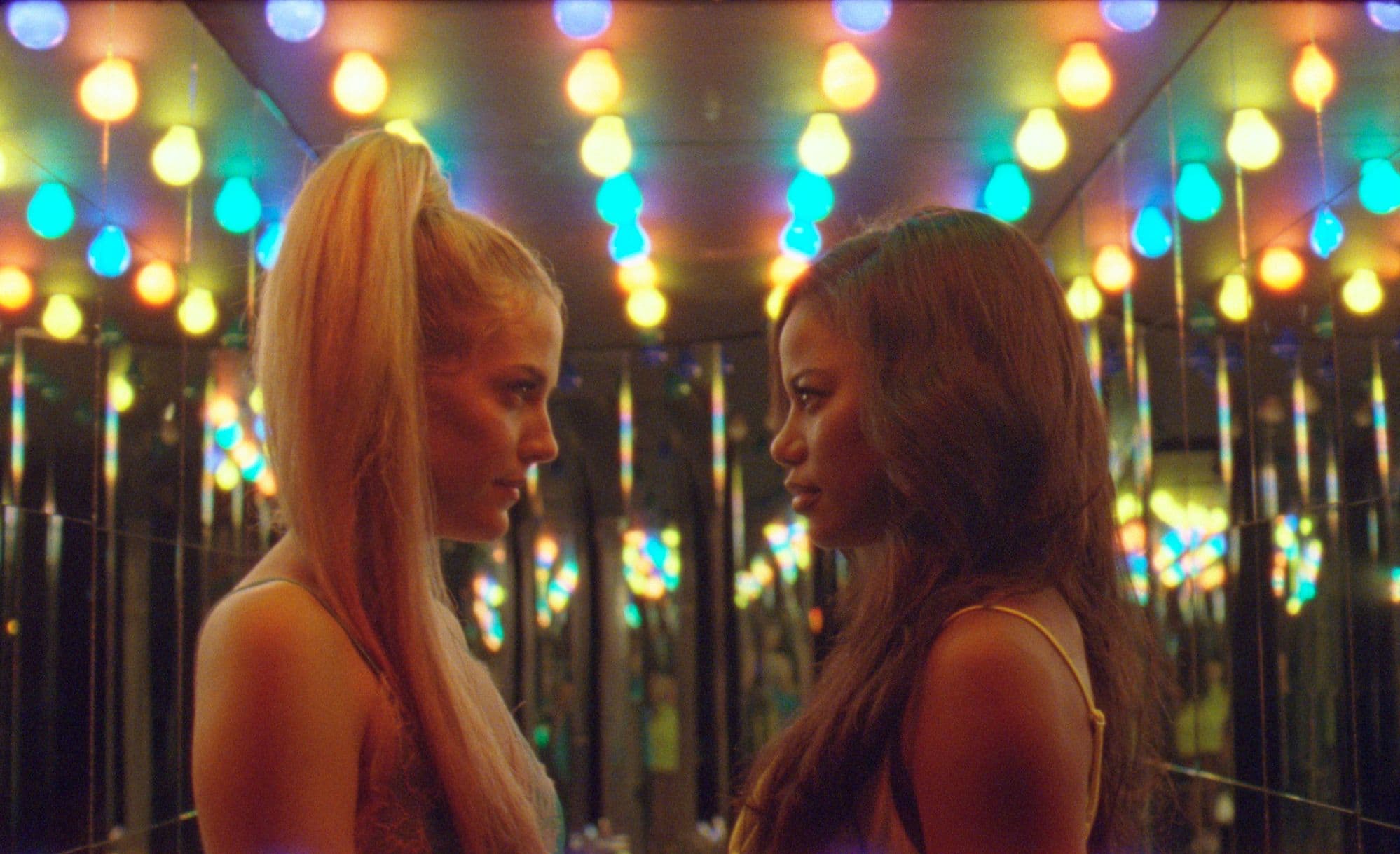 Taylour Paige (right) as Zola and Riley Keough as Stefani in "Zola." (Courtesy A24)