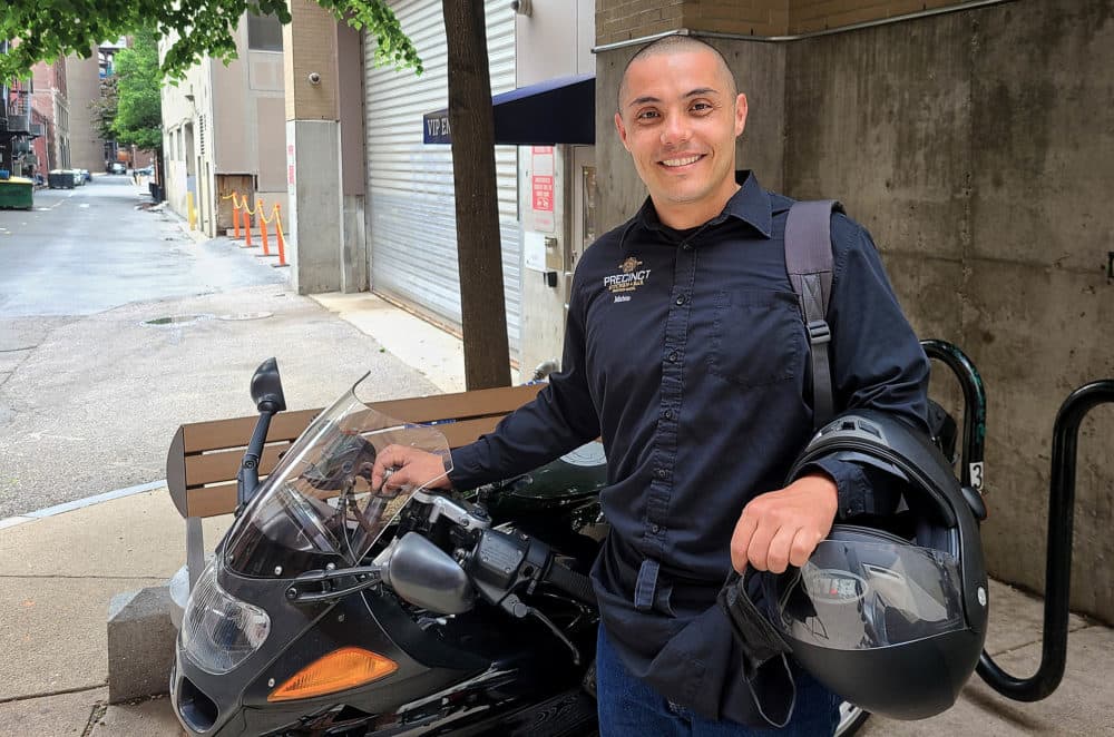Restaurant worker Mateo Mejia recently took a new job as a server in Chestnut Hill. The job pays better and has better hours than his old position, allowing him to spend mornings at home with his daughter. (Tibisay Zea for WBUR)