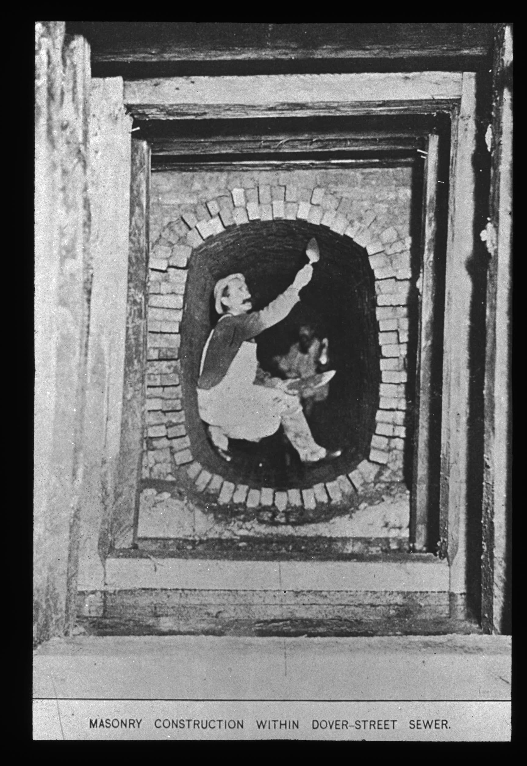 A mason applies mortar to a brick sewer line under construction in the 1880s (Courtesy Boston Public Library)