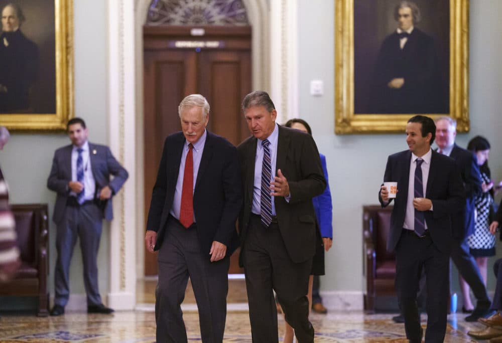 Sen. Angus King, I-Maine, left, and Sen. Joe Manchin, D-W.Va., walk to the chamber as the Senate tries to finish to its work going into the Memorial Day recess with Republican leaders insisting they will block a commission on the Jan. 6 insurrection, at the Capitol in Washington, Friday, May 28, 2021. (J. Scott Applewhite/AP)