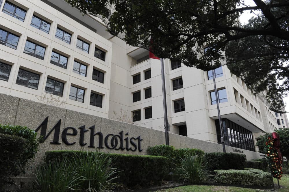 Trees and shrubs line the street in front of Methodist Hospital in Houston's Medical Center in 2012. (Pat Sullivan/AP)