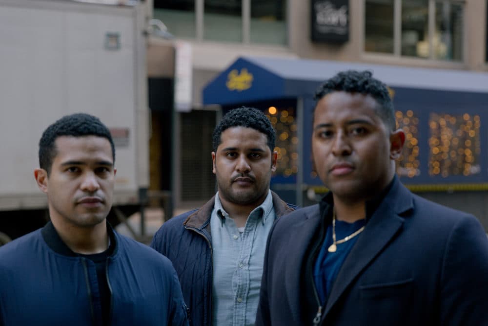 (From left) Dominique, Alan and Christian Pean near their shared home in New York City. (Al J Thompson for KHN)