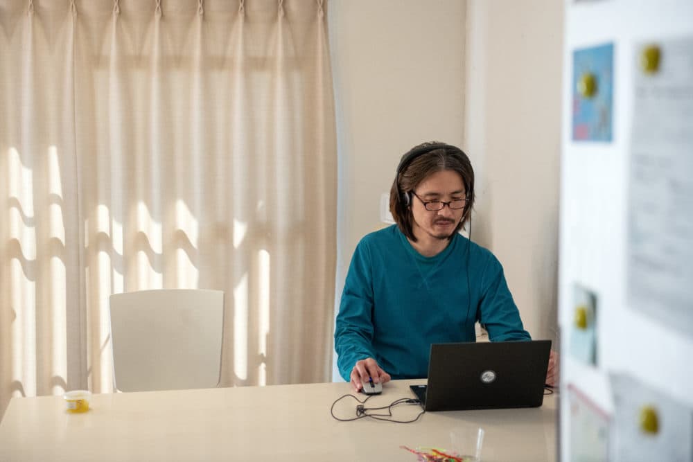 A man takes part in a Zoom meeting with colleagues while working from home during the pandemic. (Carl Court/Getty Images)