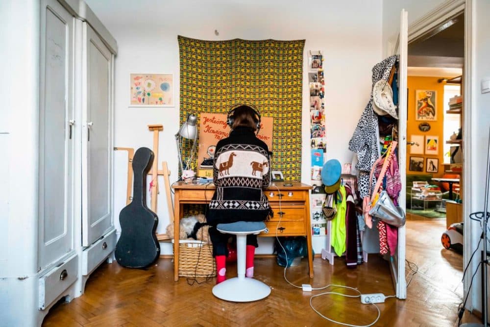 A high school student works on lessons in her room. (Wojtek Radwanksi/ AFP via Getty Images)