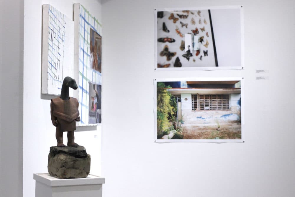 The Boston LGBTQIA+ Artist Alliance (BLAA) exhibition features work from early and mid-career artists. Works shown here by Vick Quezada, Meera Chuahan and Annielly Camargo. (Jenn Stanley for WBUR)