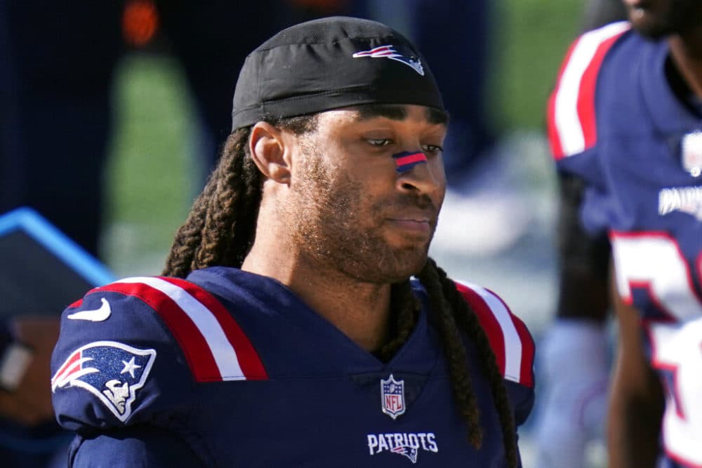 New England Patriots cornerback Stephon Gilmore stands along the sideline during an October game against the Denver Broncos in Foxborough, Mass. Gilmore has reported to the team for training camp but will start it on the physically unable to perform list. Gilmore was one of eight Patriots players added to the list ahead of the official start of camp next week. (Charles Krupa/AP)