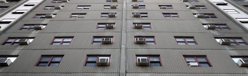 Air Conditioners in windows at Mass Pike Towers in Boston on June 9, 2021. (David L. Ryan/The Boston Globe via Getty Images)