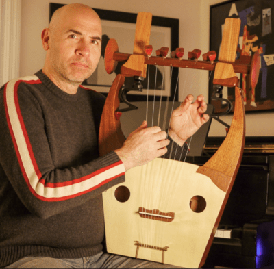 Composer Eric Shimelonis playing the kithara. (courtesy of Rebecca Sheir)