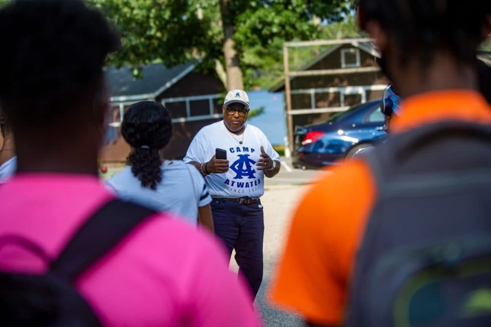 After campers arrive from Springfield by bus, Urban League of Springfield President Henry Thomas III gives the words of encouragement to do anything they wish and to enjoy themselves while they are at Camp Atwater. (Jesse Costa/WBUR)
