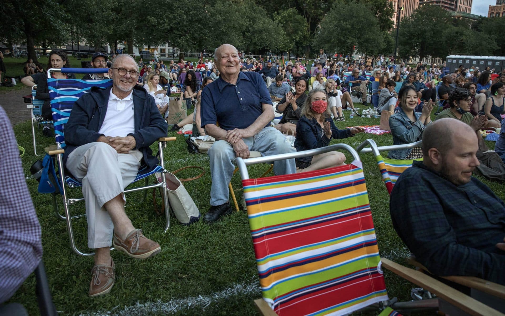 Stanley Sayer and Craig Pierce wait for the start of the performance of "The Tempest" on Boston Common. (Robin Lubbock/WBUR)