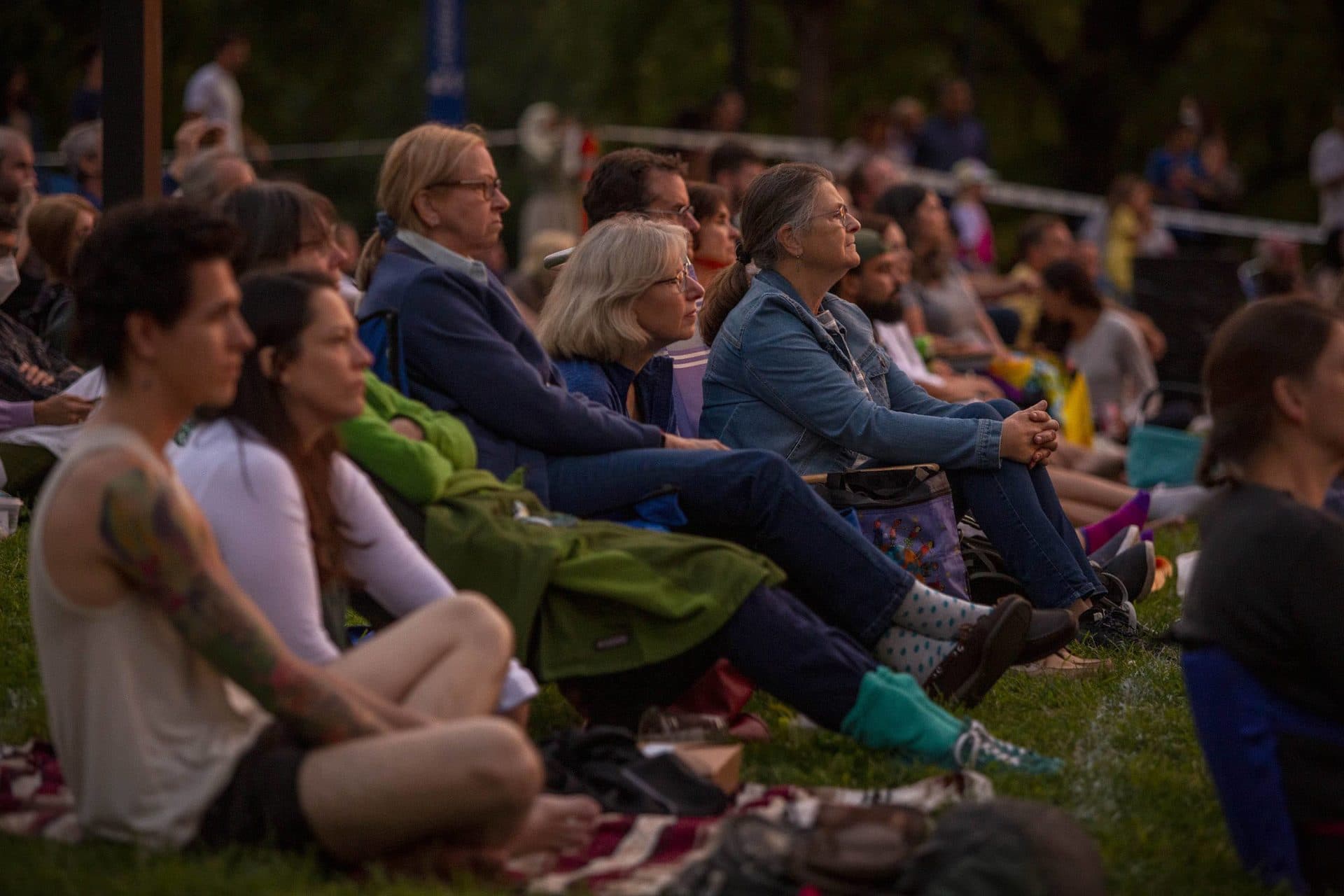 As darkness falls, the audience watches "The Tempest" on Boston Common. (Robin Lubbock/WBUR)