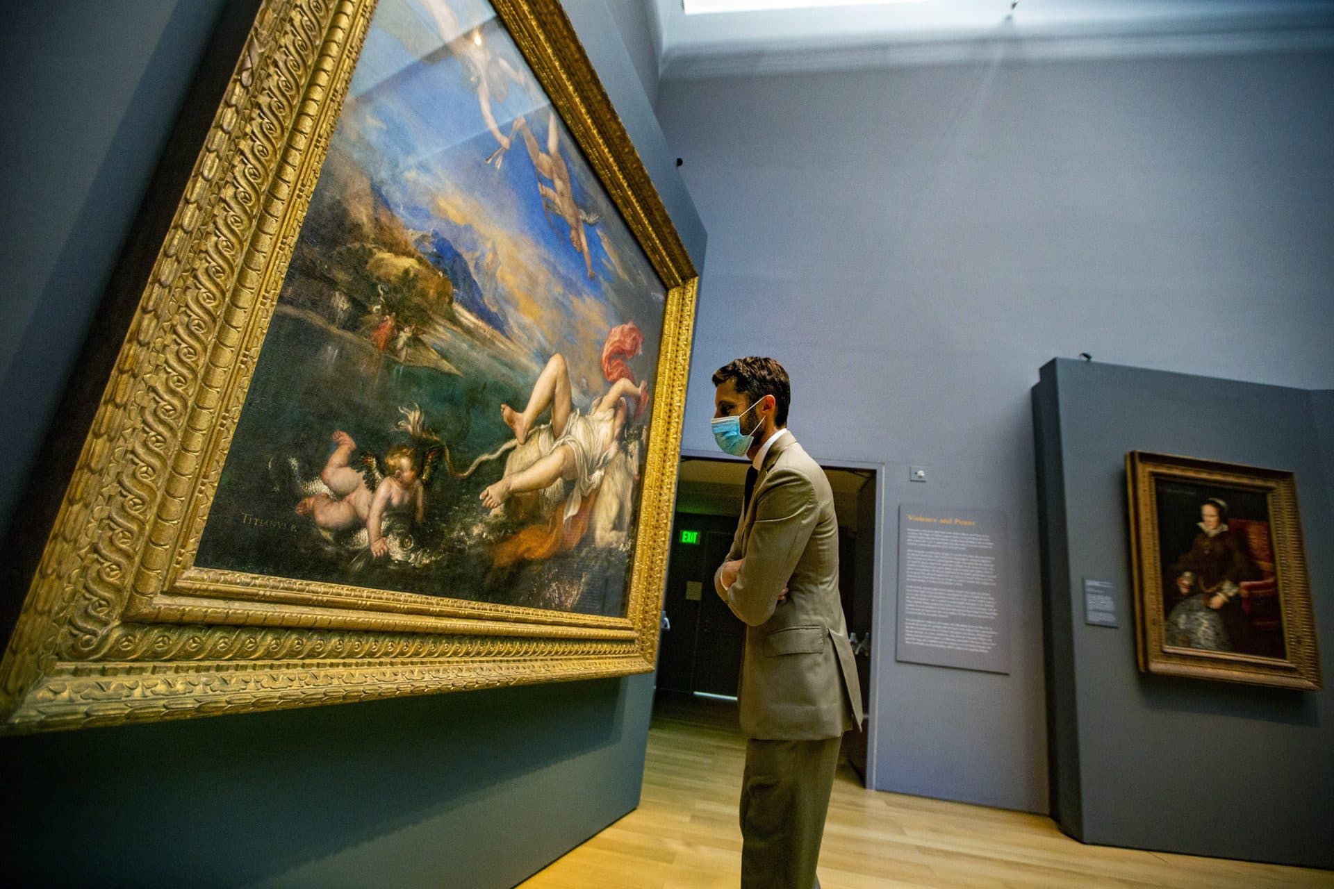 Curator Nat Silver closely examines Titian’s "The Rape of Europa" during a check of the newly installed exhibit of the artist’s work in the Hostetter Gallery at the Isabella Stewart Gardner Museum. (Jesse Costa/WBUR)