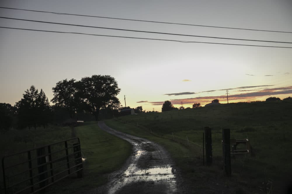 The sun sets over a field outside of Anna, Illinois. "Sundown towns" like Anna were places where Black people were allowed in during the day to work or shop but had to be gone by nightfall. Today, some still exist in various forms, enforced now by tradition and fear rather than by rules. (Wong Maye-E/AP)