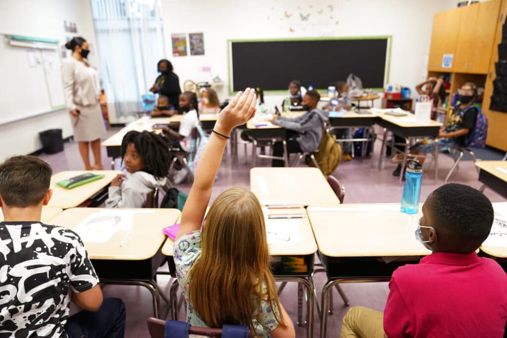 A student raises their hand in a classroom at Tussahaw Elementary school on Wednesday, Aug. 4. (AP Photo/Brynn Anderson)