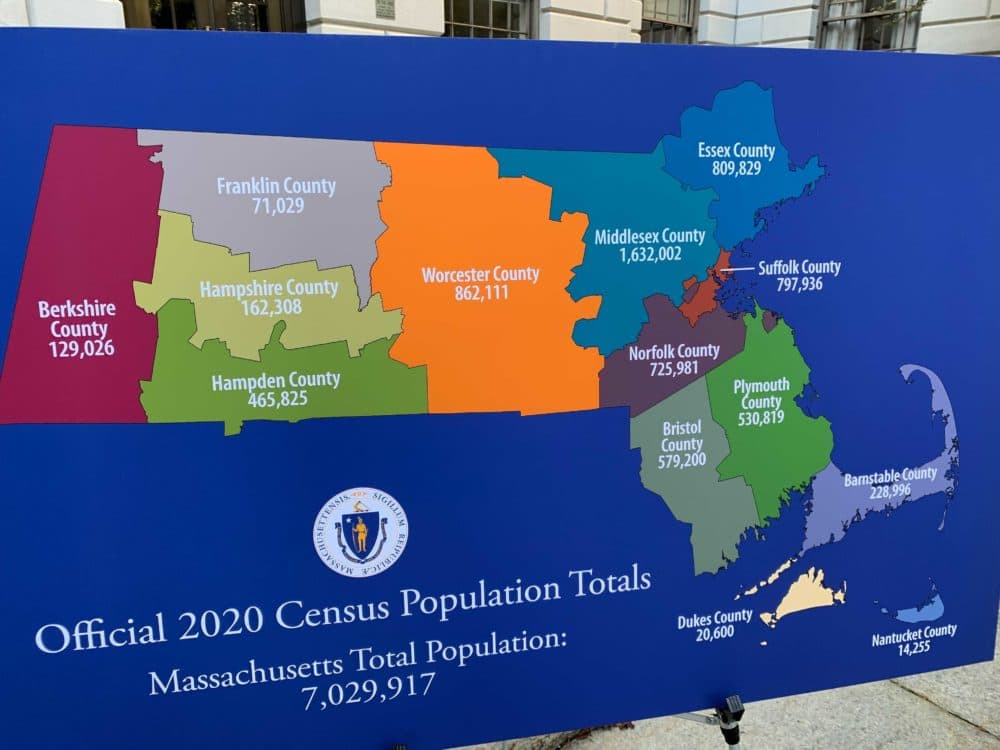 A placard shows the new county-level population numbers from the 2020 U.S. Census (Steve Brown/WBUR)