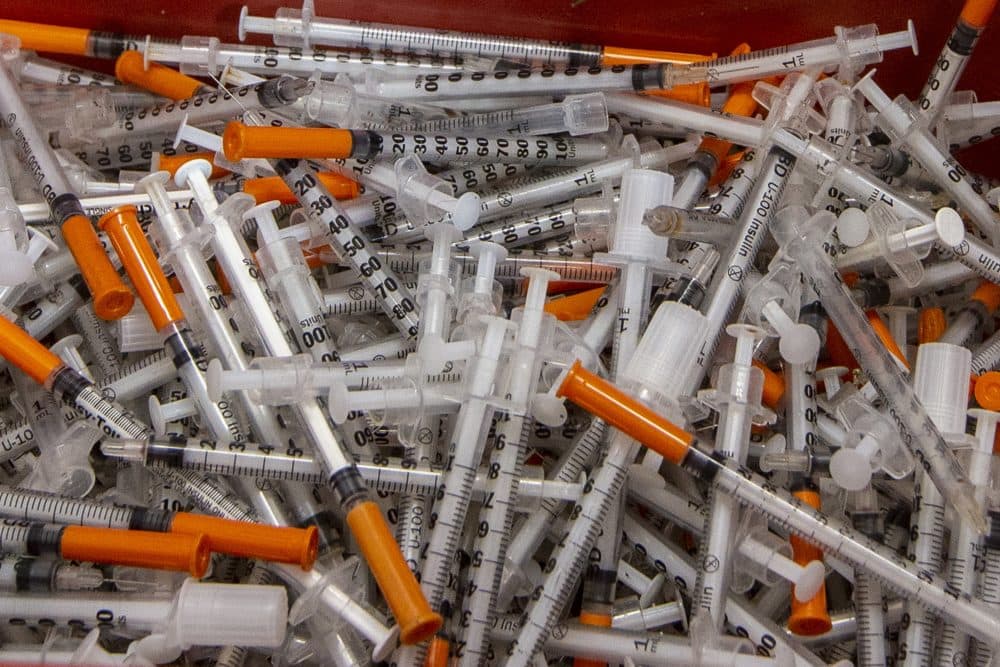 Used syringes in a sharps container collected at the Southampton Street Shelter. (Jesse Costa/WBUR)