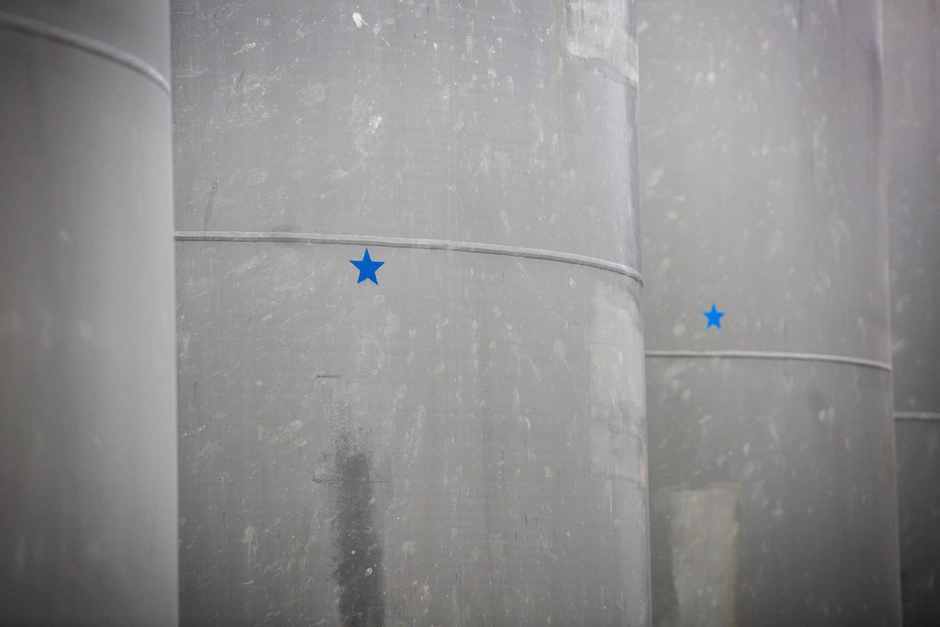 The blue stars on spent fuel casks mark radiological survey points. (Robin Lubbock/WBUR)