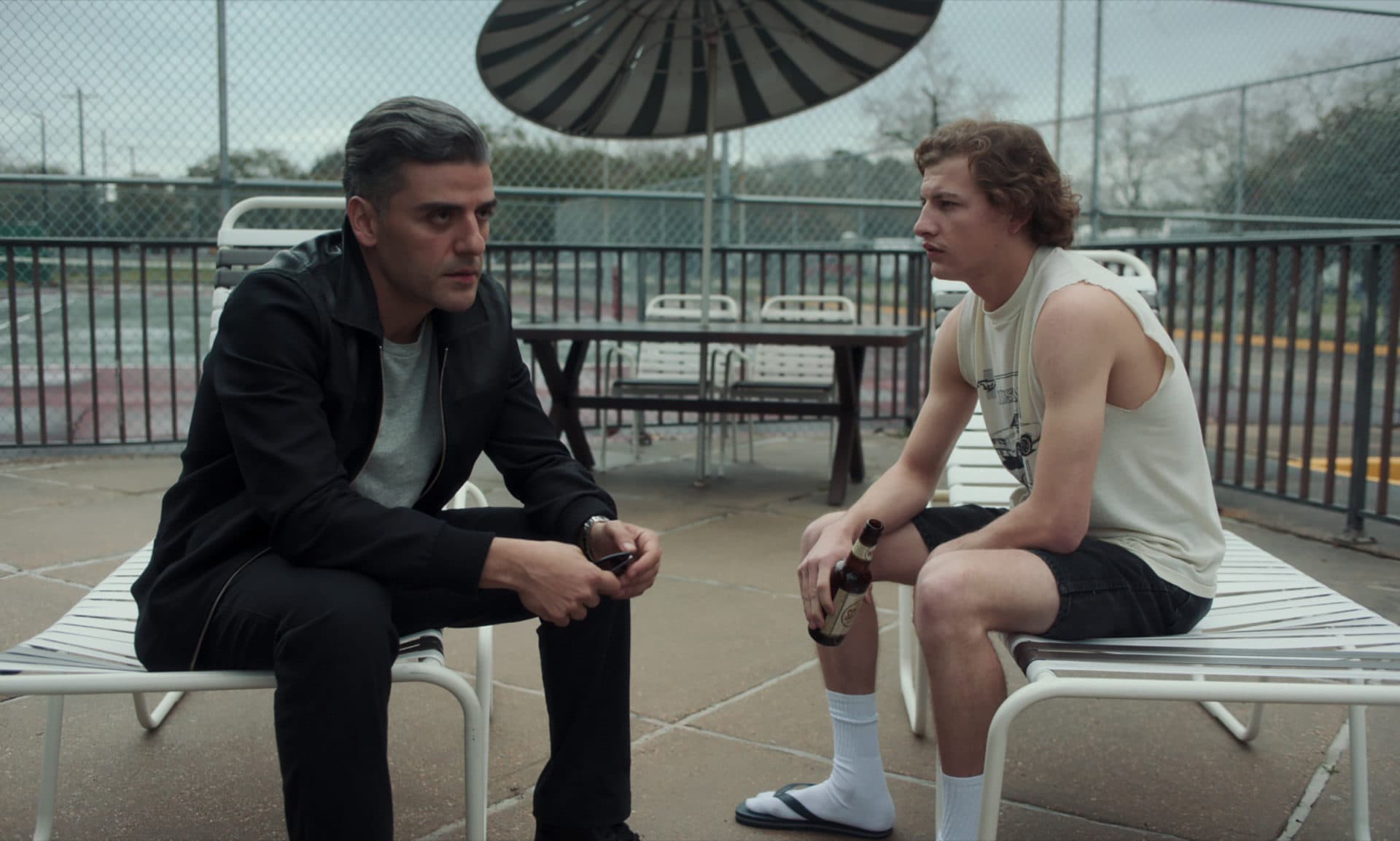Oscar Isaac as William Tell and Tye Sheridan as Cirk in "The Card Counter." (Courtesy Focus Features)