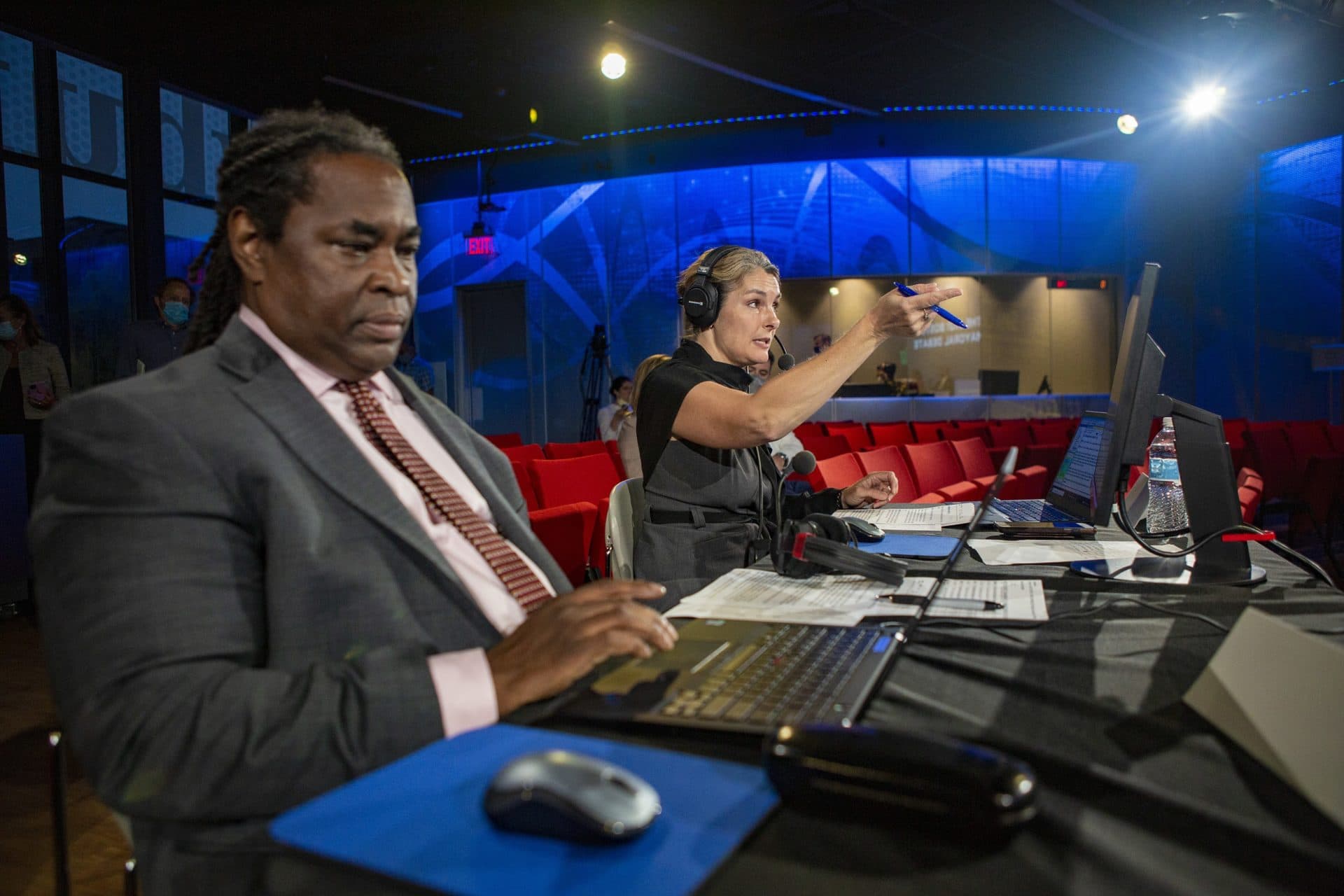 Moderators Adrian Walker of The Boston Globe and WBUR’s Tiziana Dearing, lay out the ground rules for the debate. (Jesse Costa/WBUR)