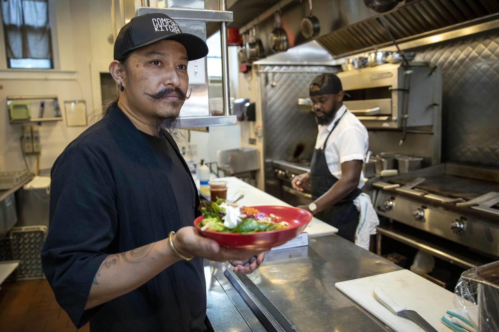 Comfort Kitchen managing partner Biplaw Rai and chef Kwasi Kwaa at Little Dipper in Jamaica Plain. (Robin Lubbock/WBUR)