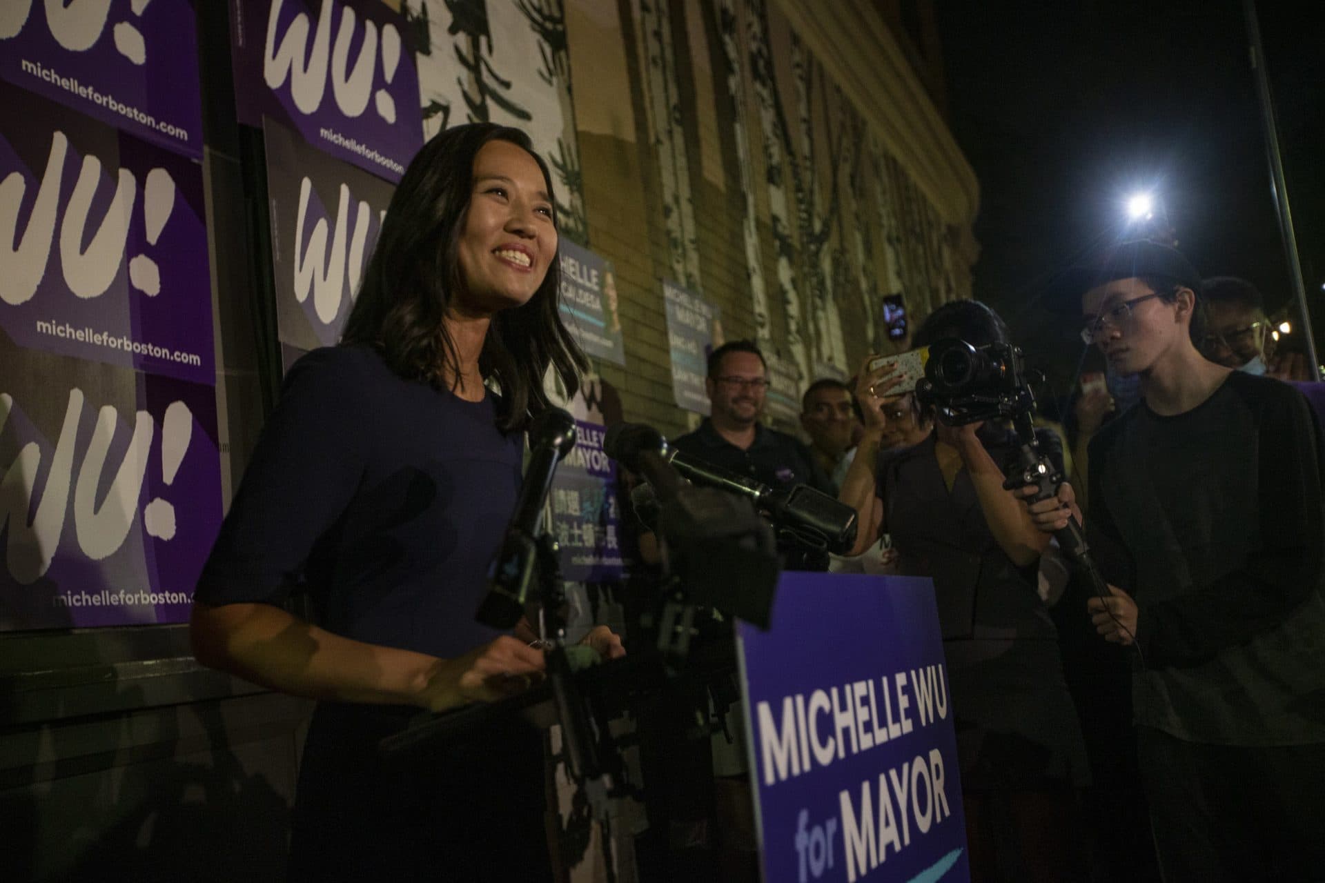 A jubilant Michelle Wu speaks to supporters at Distraction Brewing Company in Roslindale before the official vote has been finalized. (Jesse Costa/WBUR)