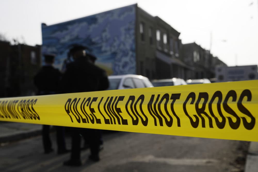 Police gather at the scene of a quadruple fatal shooting in Philadelphia. (Matt Rourke/AP)