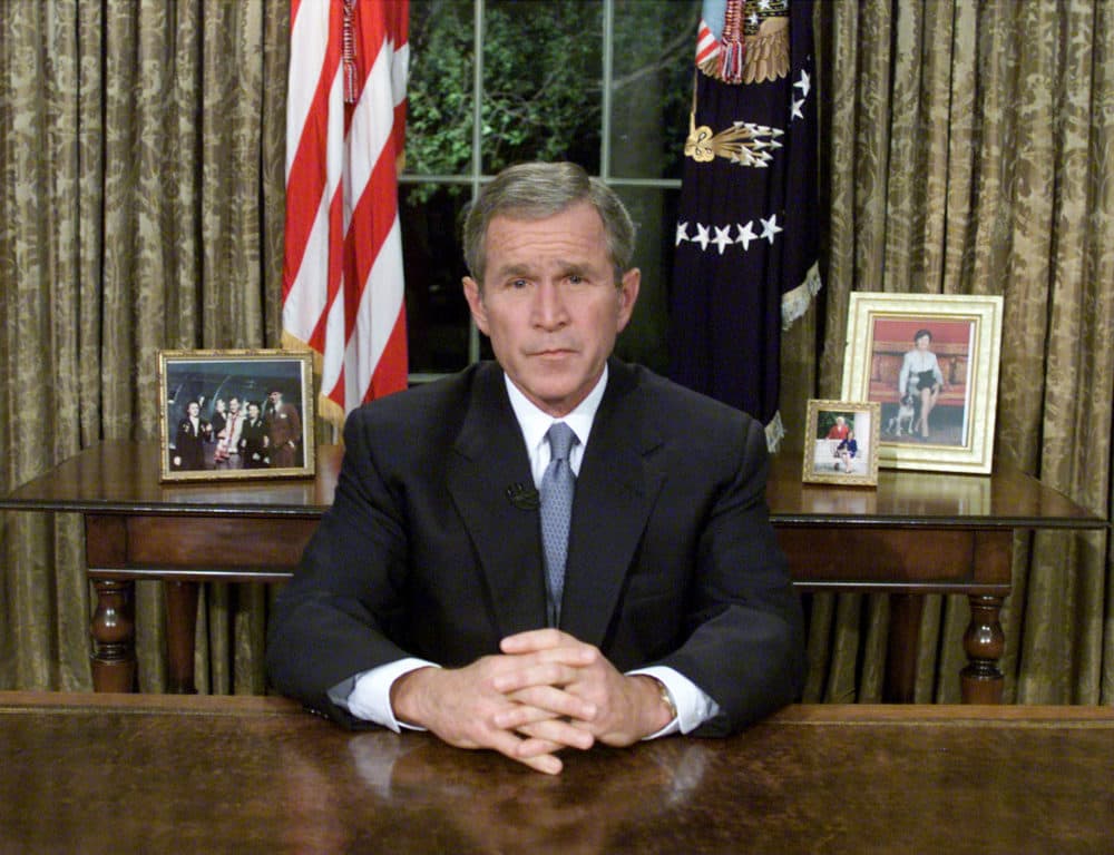 Former President George W. Bush sits at his desk in the Oval Office after addressing the nation about the terrorist attacks on New York and Washington, DC Sept. 11, 2001 in Washington, DC. (Mark Wilson/Getty Images)